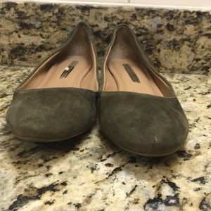 Army green slipper shoes.